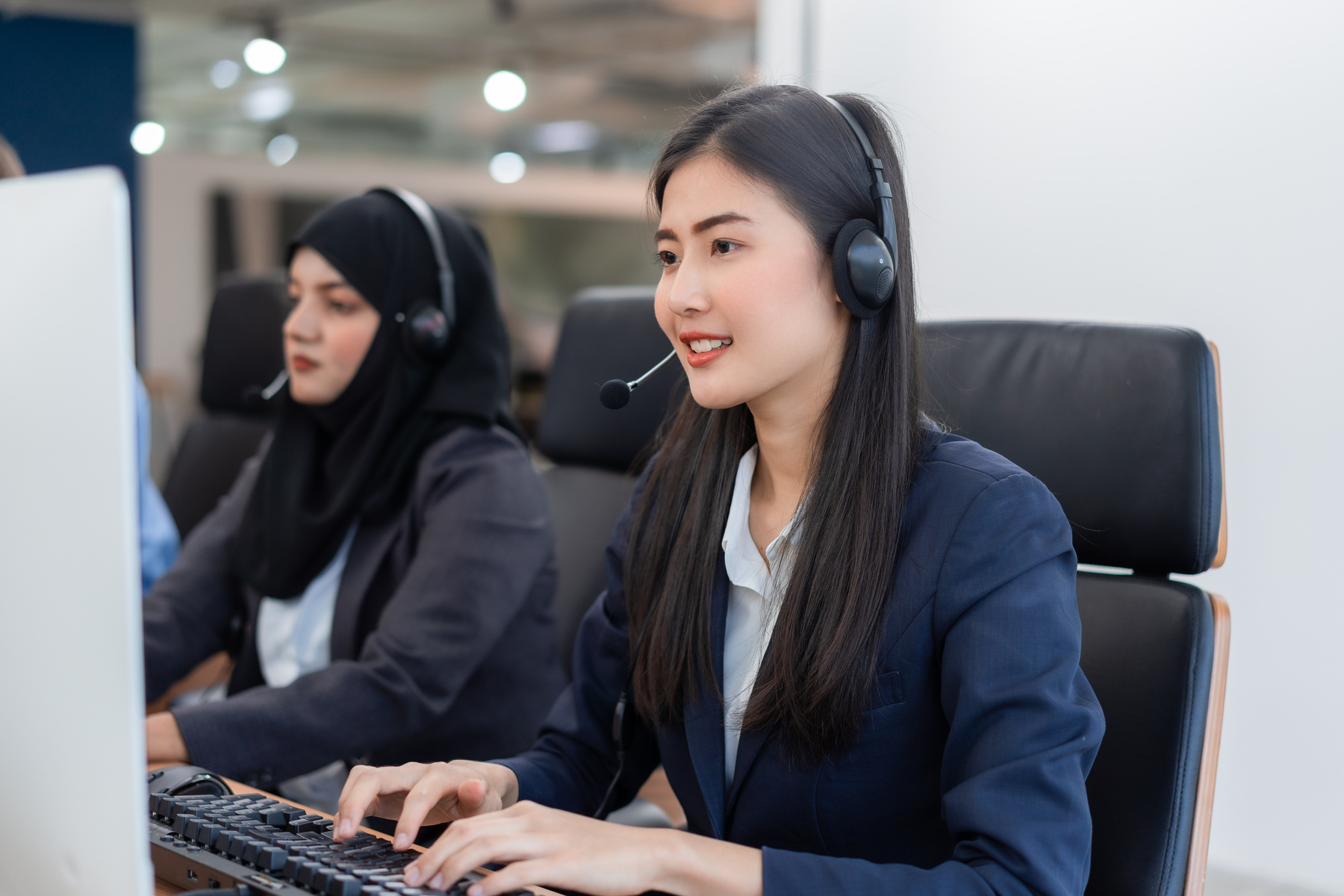 Customer Service Agent with Headsets Working in a Call Center